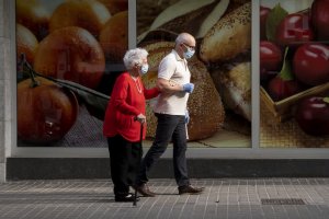 A man accompanying an elderly lady