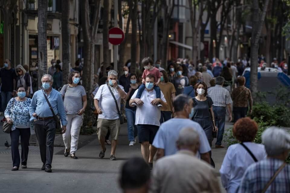 People walking with face masks in Catalonia