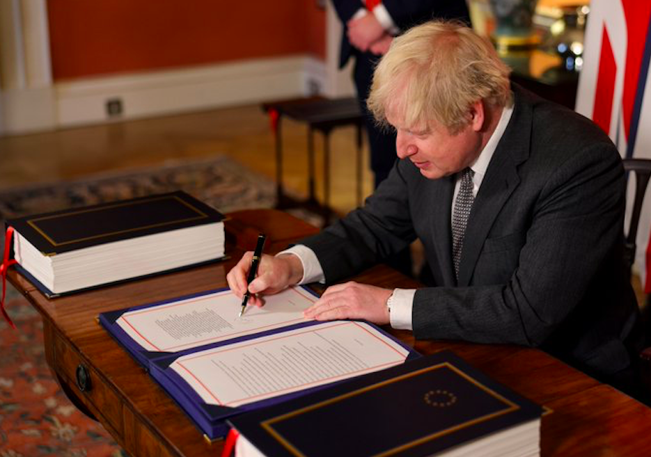 Boris Johnson signing trade agreement