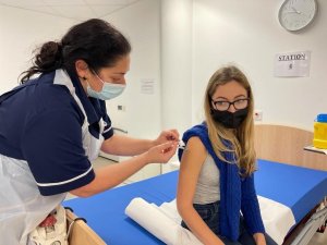 A Gibraltar university student receiving the vaccine against Covid-19