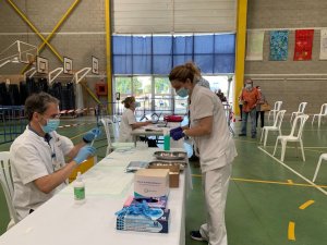 Health workers preparing to administer vaccinations in Catalonia