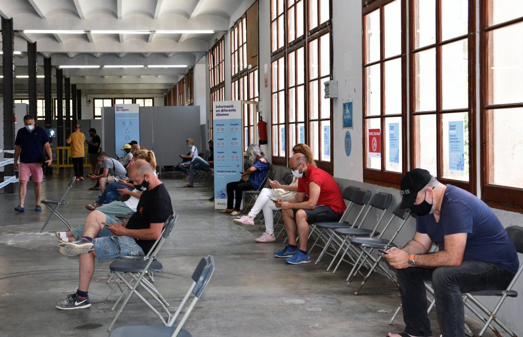 Citizens waiting for vaccinations at the Llobet-Guri Factory in Calella, in Alt Maresme, Catalonia