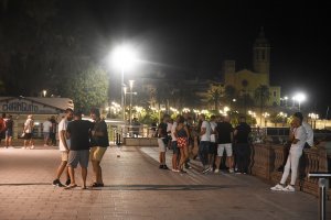 Young people on La Ribera seafront in Sitges