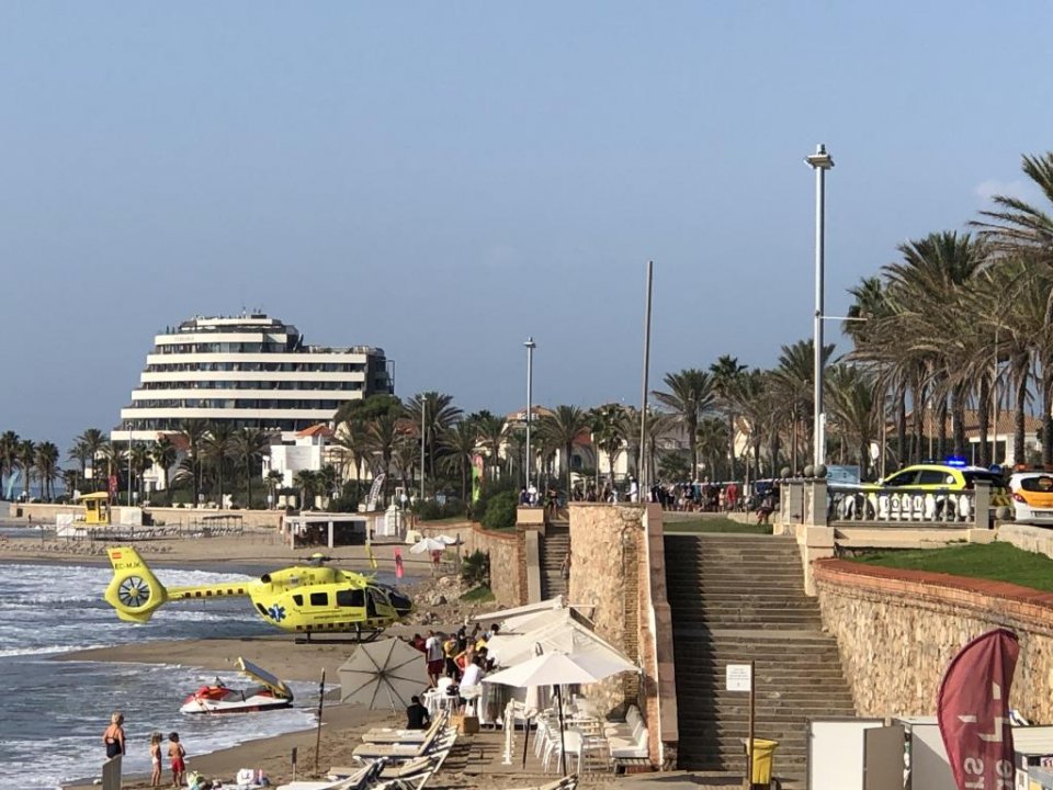 The helicopter on the beach and the ambulances on the promenade in Sitges