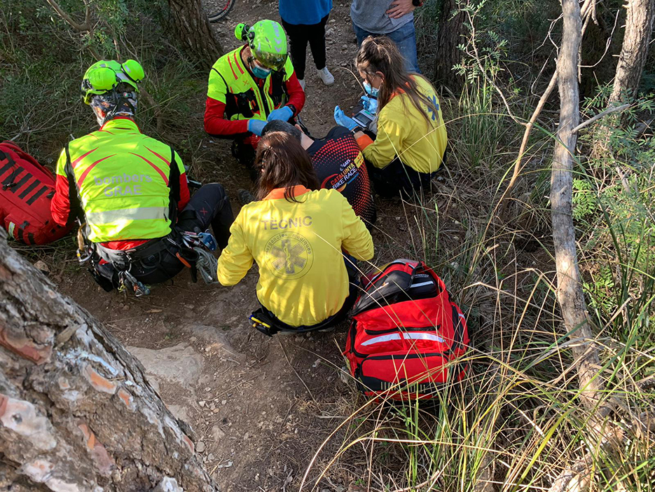 Paramedics attend to the cyclist.